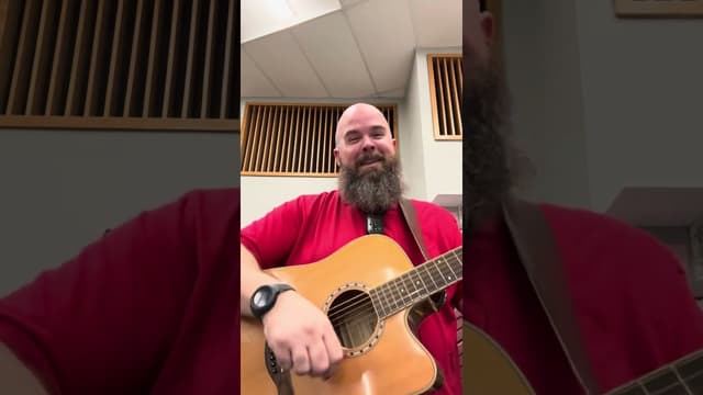 Mr. Vans Evers playing guitar